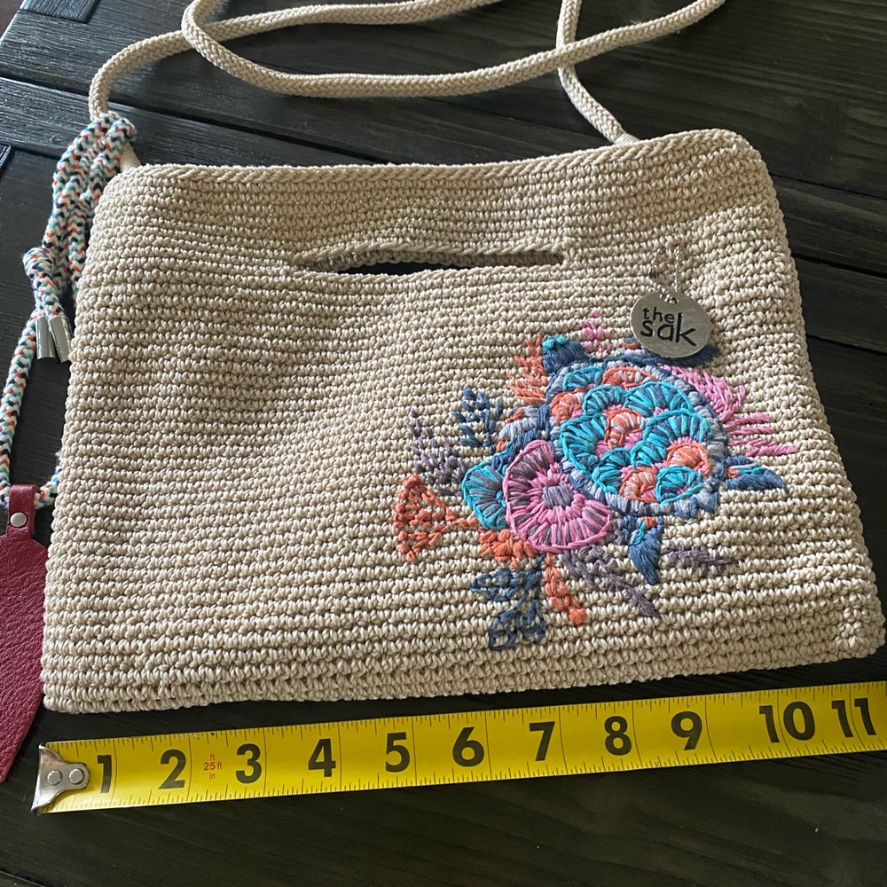 SAK small cream color crossbody with turtle appliqué